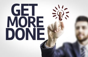 Business man pointing to transparent board with text Get More Done
